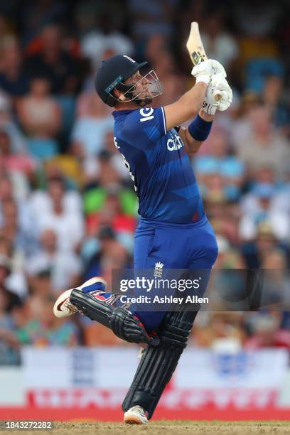 Liam Livingstone of England hits six runs during the third CG United One Day International match between West Indies and England at Kensington Oval...