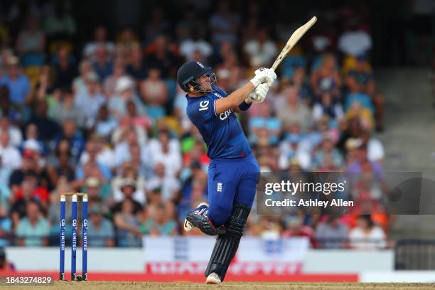 Liam Livingstone of England hits six runs during the third CG United One Day International match between West Indies and England at Kensington Oval...