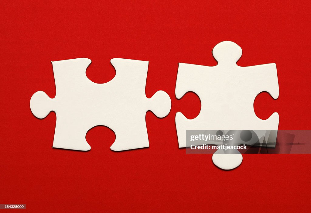 Jigsaw pieces on red background