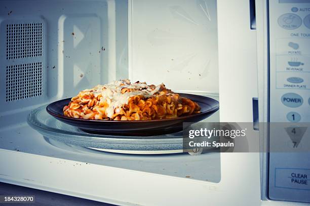 microwaved lasagne - mikrowelle stock-fotos und bilder