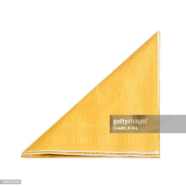 a folded yellow napkin on a white background - napkin stock pictures, royalty-free photos & images