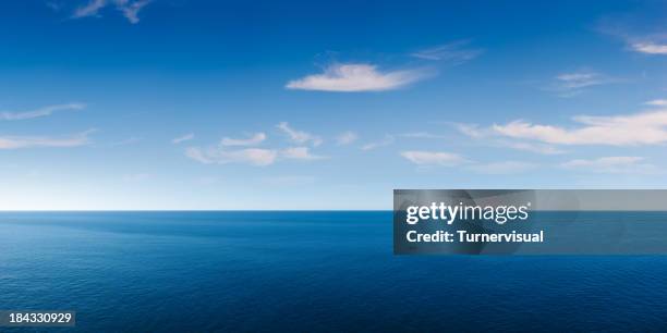 deep blue ocean panorama - panoramic sky stock pictures, royalty-free photos & images