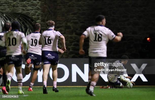 Rio Dyer of Dragons RFC scores their team's third try during the EPCR Challenge Cup match between Dragons RFC and Oyonnax Rugby at Rodney Parade on...