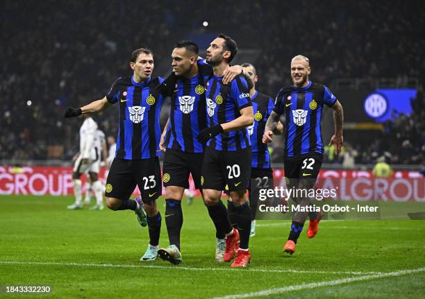 Lautaro Martinez of FC Internazionale celebrates after scoring his team's fourth goal with teammates Nicolo Barella and Hakan Calhanoglu during the...