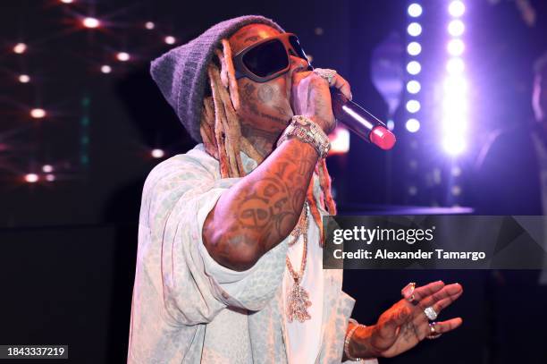 Lil Wayne performs onstage at Wayne & Cynthia Boich's Art Basel party on December 08, 2023 in Miami Beach, Florida.