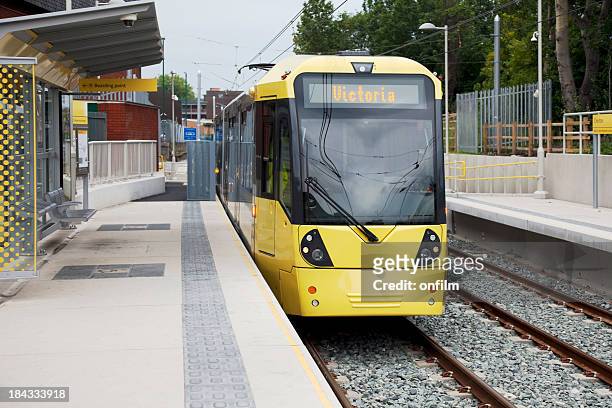 new manchester materolink tram station - manchester england stock pictures, royalty-free photos & images