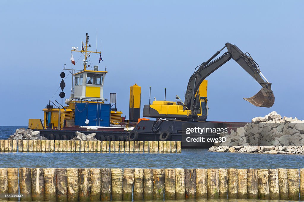 Excavator in a pier construction site