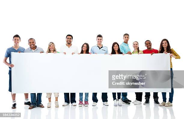 large group holding a big white board. - vasthouden stockfoto's en -beelden