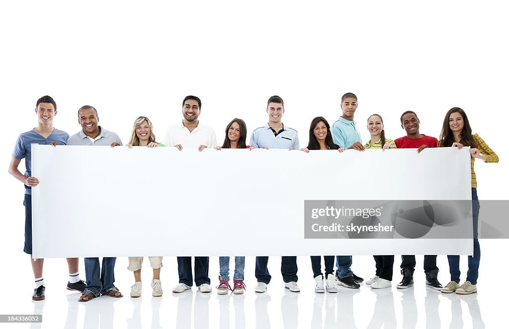 Large group holding a big white board.