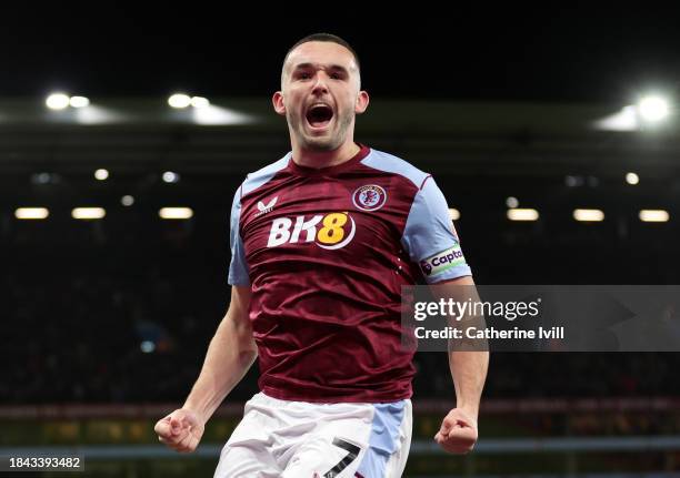 John McGinn of Aston Villa celebrates scoring their team's first goal during the Premier League match between Aston Villa and Arsenal FC at Villa...