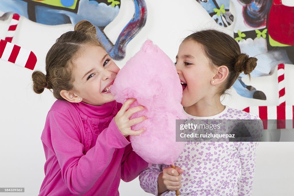 Happy friends having fun at amusement park - studio shot