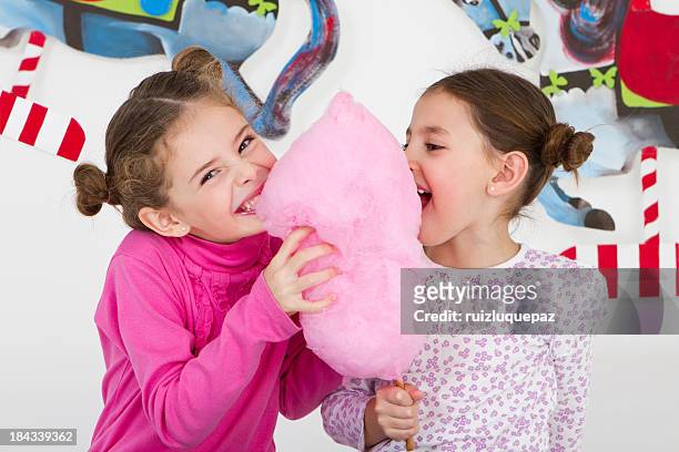 happy friends having fun at amusement park - studio shot - cotton candy stock pictures, royalty-free photos & images