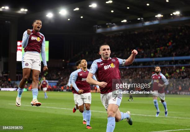 John McGinn of Aston Villa celebrates scoring their team's first goal during the Premier League match between Aston Villa and Arsenal FC at Villa...