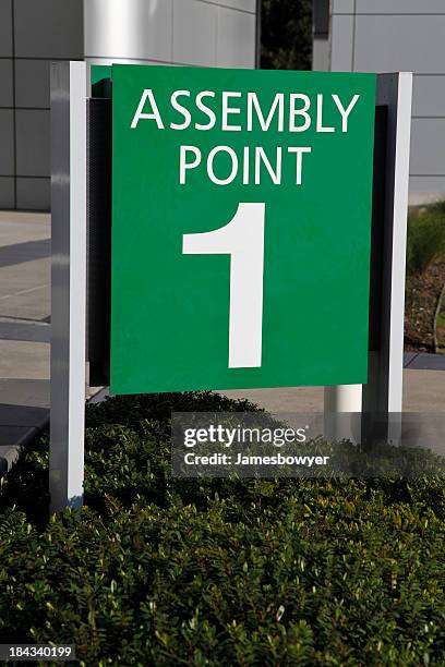 assembly point sign - assembly room stock pictures, royalty-free photos & images