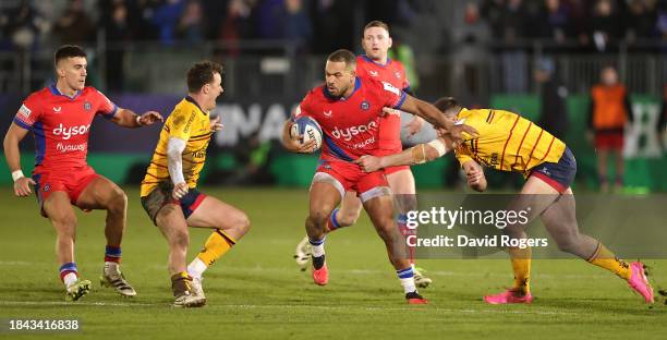 Ollie Lawrence of Bath is tackled by Stuart McCloskey during the Investec Champions Cup match between Bath and Ulster at the Recreation Ground on...