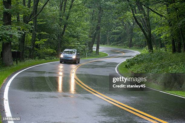 car driving on skyline drive, shenandoah national forest, virginia - wet road stock pictures, royalty-free photos & images