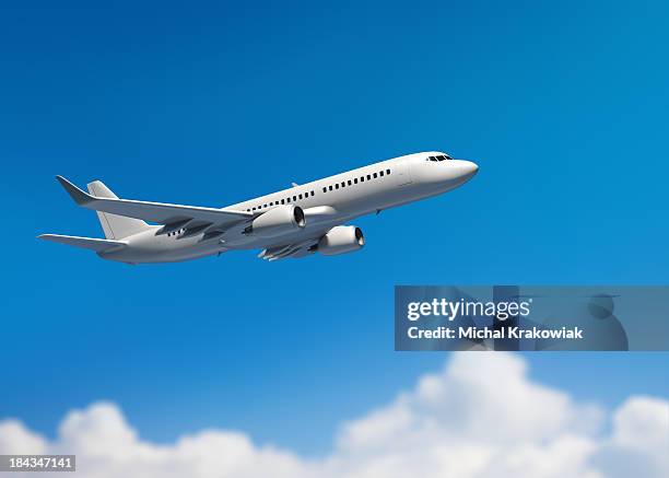 white mid-sized passenger jet airplane - aeroplane stockfoto's en -beelden