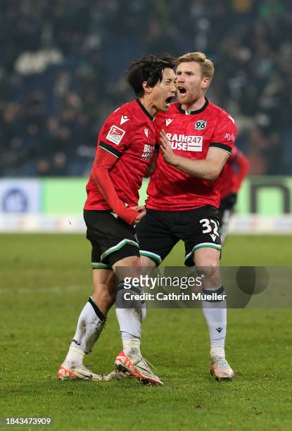 Sei Muroya of Hannover 96 celebrates scoring his team's second goal with teammate Andreas Voglsammer during the Second Bundesliga match between...