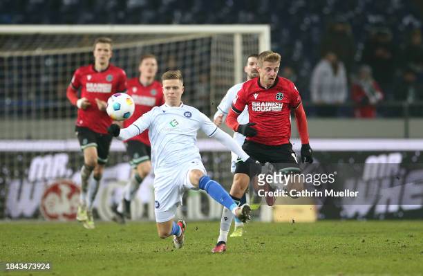 Dzenis Burnic of Karlsruher SC and Sebastian Ernst of Hannover 96 battle for the ball during the Second Bundesliga match between Hannover 96 and...