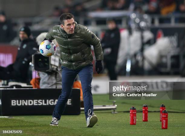 Christian Eichner, Head Coach of Karlsruher SC throws the ball during the Second Bundesliga match between Hannover 96 and Karlsruher SC at Heinz von...