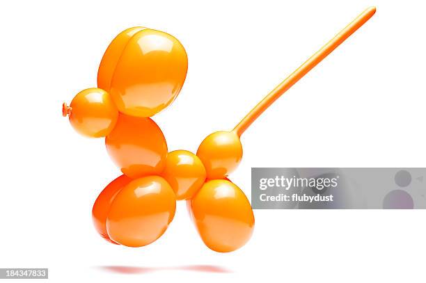 an orange dog with a long tail made out of a balloon - balloons stock pictures, royalty-free photos & images