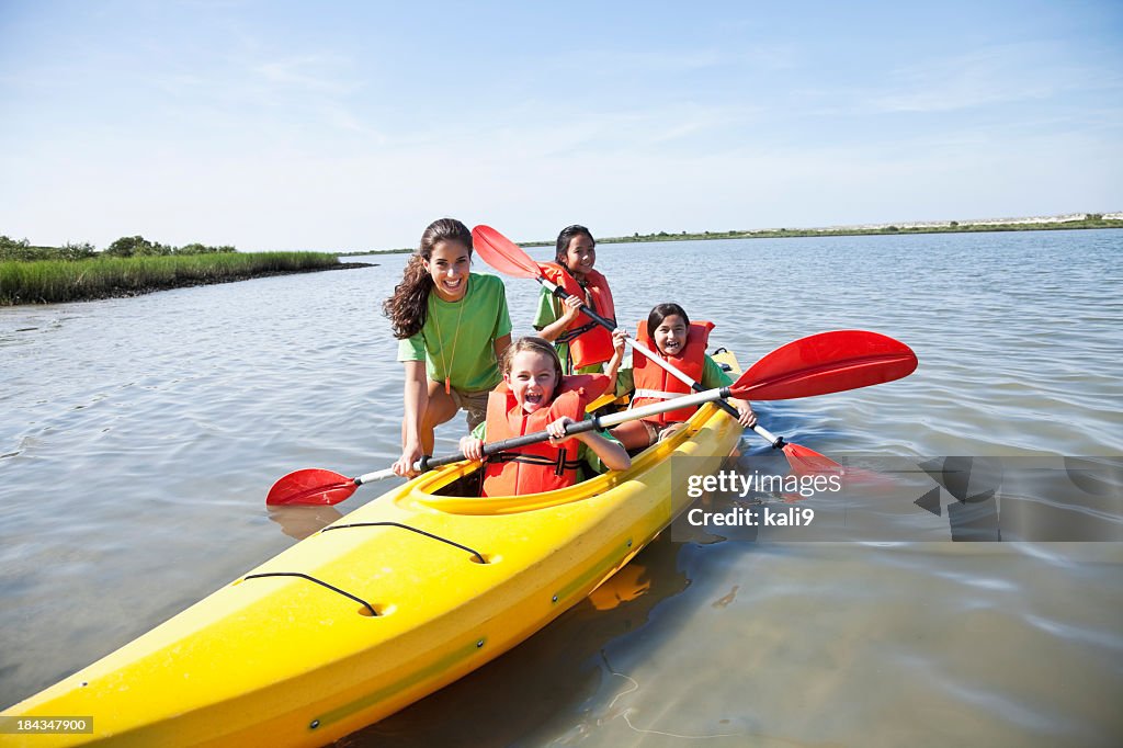 Girls in a double kayak