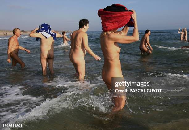 Naked people from six countries enjoy a Mediterranean bath in Cap d'Adge as water temperature reaches 8°C, southern France, 31 December 2006. The...