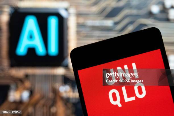 In this photo illustration, the Japanese multinational clothing design retail company Uniqlo logo seen displayed on a smartphone with an Artificial...