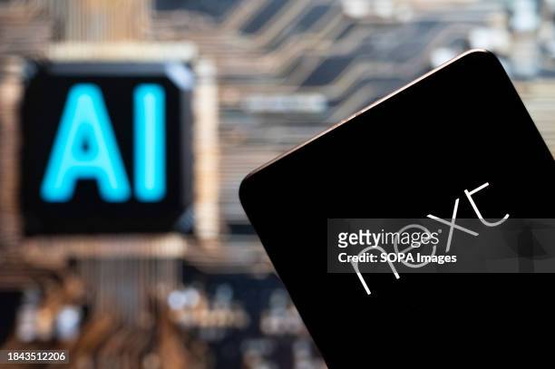In this photo illustration, the British multinational clothing, footwear and home products retailer NEXT plc logo seen displayed on a smartphone with...
