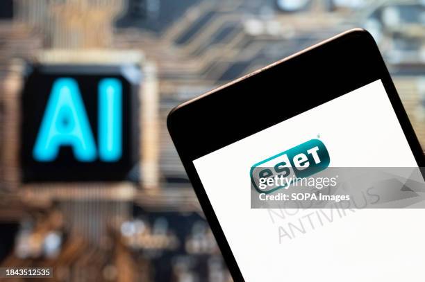 In this photo illustration, the IT security and software company ESET logo seen displayed on a smartphone with an Artificial intelligence chip and...