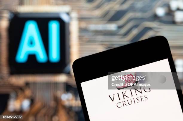 In this photo illustration, the cruise line company Viking Cruises logo seen displayed on a smartphone with an Artificial intelligence chip and...