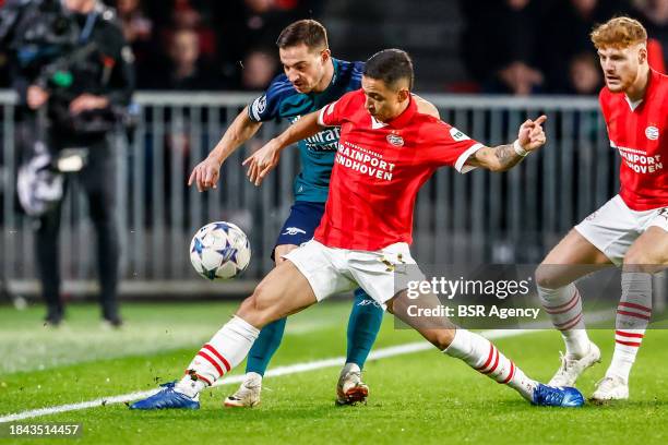 Cedric Soares of Arsenal battles for the ball with Mauro Junior of PSV during the UEFA Champions League Group B match between PSV and Arsenal at the...