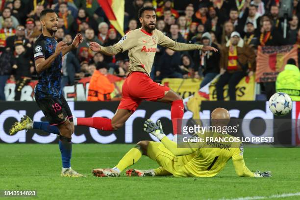 Lens' French midfielder Angelo Fulgini shoots to score his team's second goal during the Champions League football match between RC Lens and Sevilla...