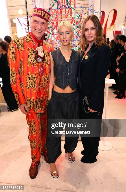 Andrew Logan, Iris Law and Stella McCartney attend the opening of Stella McCartney at the Selfridges Corner Shop on December 12, 2023 in London,...