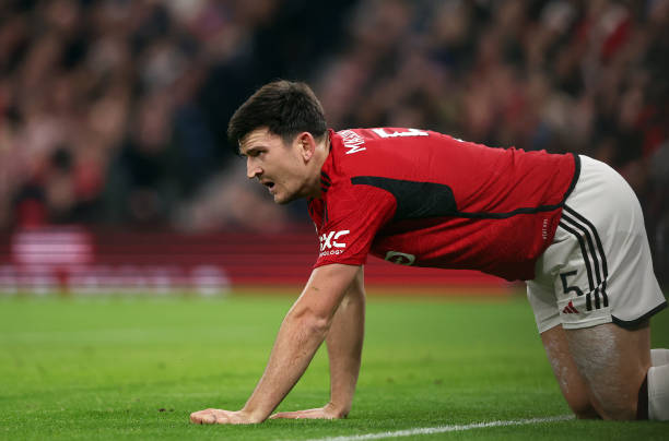 Manchester United's Harry Maguire is grounded during the UEFA Champions League match between Manchester United and FC Bayern Munich at Old Trafford...