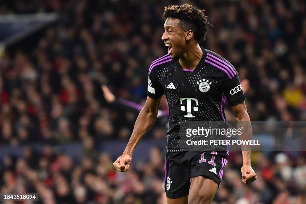 Bayern Munich's French forward Kingsley Coman celebrates after scoring the team's first goal during the UEFA Champions League group A football match...