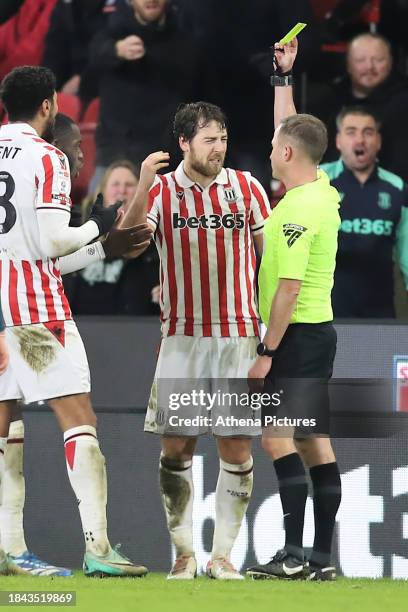 Ben Pearson of Stoke City sees a yellow card by referee David Webb during the Sky Bet Championship match between Stoke City and Swansea City at the...