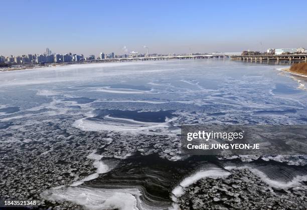 Bitter cold wind forms an ice pattern in the frozen Han River which flows through South Korea's capital Seoul on January 17, 2011. Civil servants...