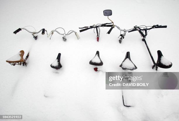 Bicycles are buried in snow in Montreal, Canada, on March 15, 2008. Montreal has accumulated some 350cm of snow this winter. AFP PHOTO/David BOILY