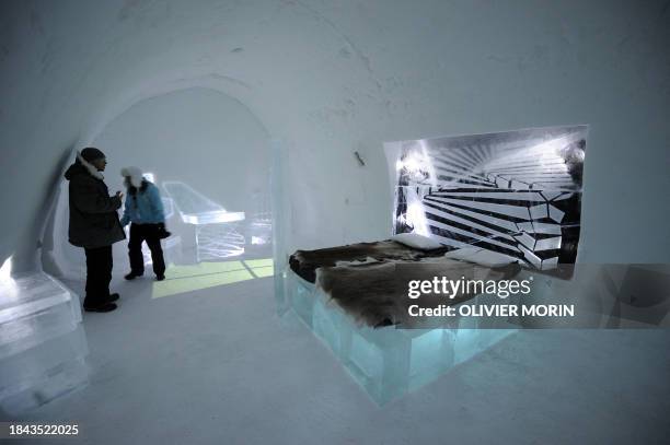 Customers visit one of the cold bedrooms on January 8, 2009 in Jukkasjaervi Ice Hotel. The temperature in every bedrooms is -5°C constant. The ice...