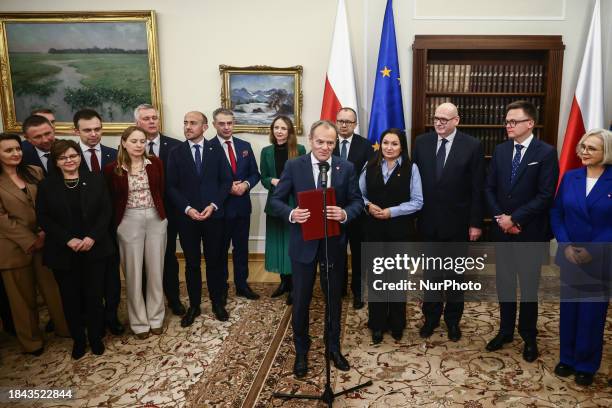 Donald Tusk, the leader of Civic Coalition and newly elected Prime Minister, is seen with members of his cabinet after winning the vote of confidence...