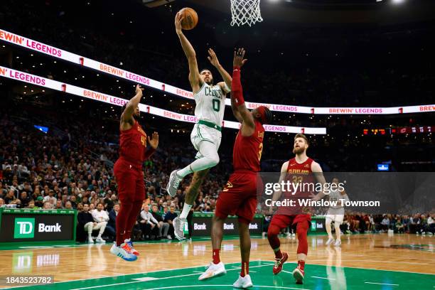 Jayson Tatum of the Boston Celtics goes to the basket against Caris LeVert of the Cleveland Cavaliers during the second quarter at TD Garden on...