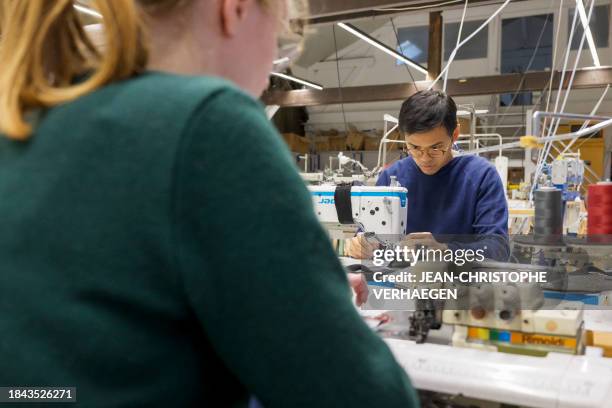 Davy Dao, founder of textile brand Dao, sews a bag made with linen vegetable leather at company headquarters in Maxeville, northeastern France, on...