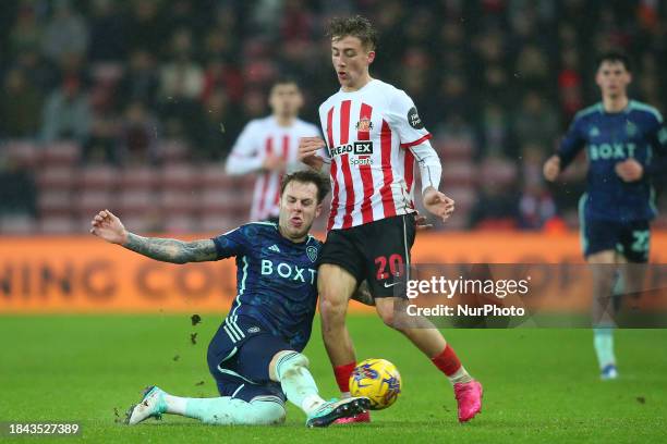 Joe Rodon of Leeds United is tackling Jack Clarke of Sunderland during the Sky Bet Championship match between Sunderland and Leeds United at the...