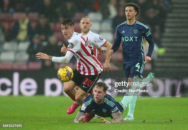 Jack Clarke is breaking away from Leeds United defenders during the Sky Bet Championship match between Sunderland and Leeds United at the Stadium of...