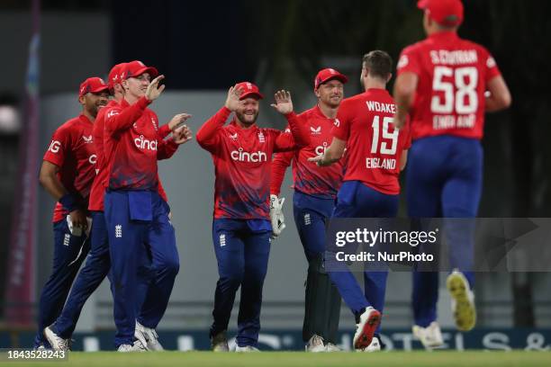 England's Ben Duckett is celebrating with his teammates after catching West Indies' Brandon King during the 1st CG United T20 International match...