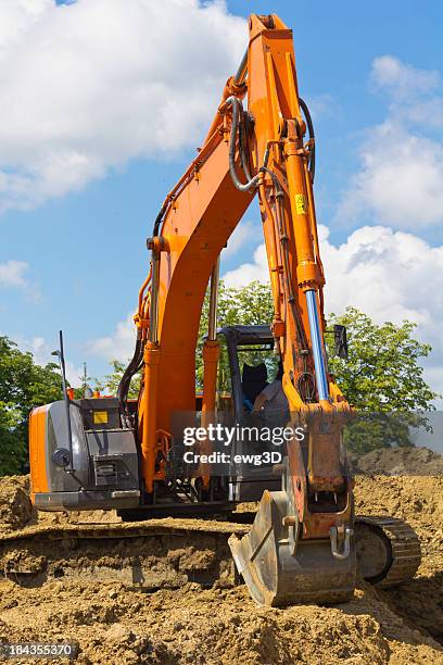 red excavator at work - dredger stock pictures, royalty-free photos & images