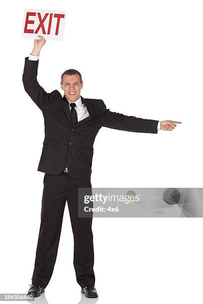 businessman holding an exit sign board - exit sign white background stock pictures, royalty-free photos & images