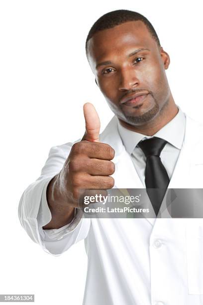 african ethnicity male wearing lab coat gesturing thumbs up - yes single word stock pictures, royalty-free photos & images