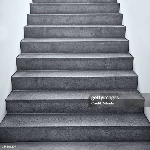 flight of stairs in a building - concrete stairs stock pictures, royalty-free photos & images